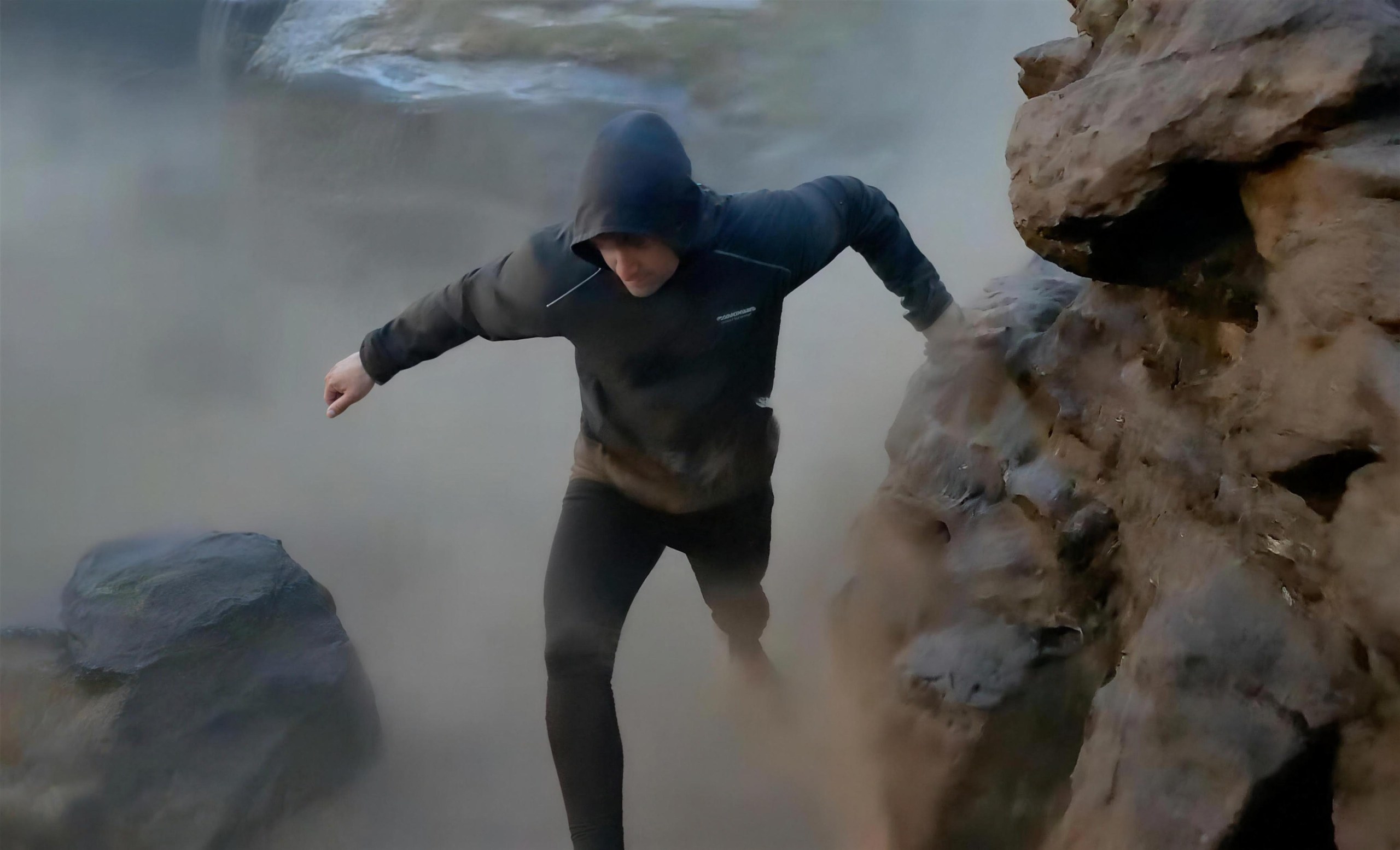 Air Jacket worn scrambling up misty rocks