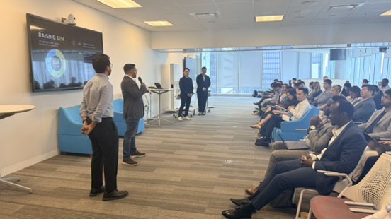 Aurmada pitching to a seated audience at the ID8 Ventures Pitch, hosted at EY in Toronto